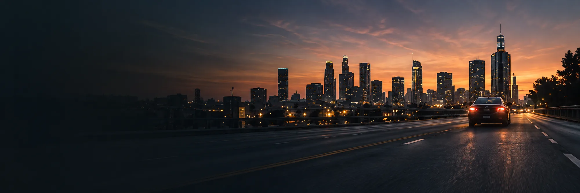 Downtown Los Angeles skyline at dusk from the freeway