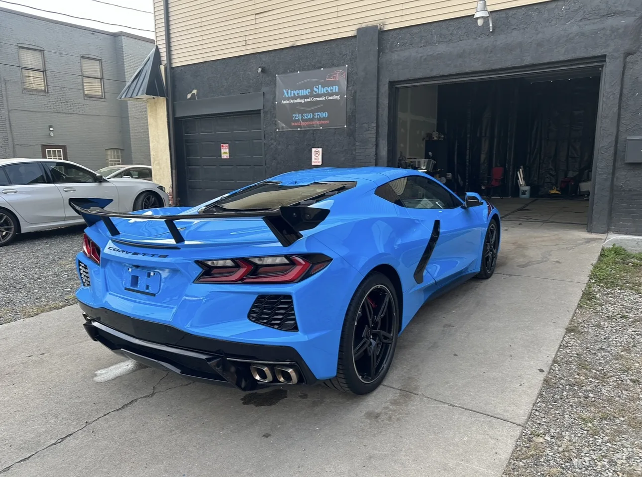 Blue Corvette outside the Xtreme Sheen shop