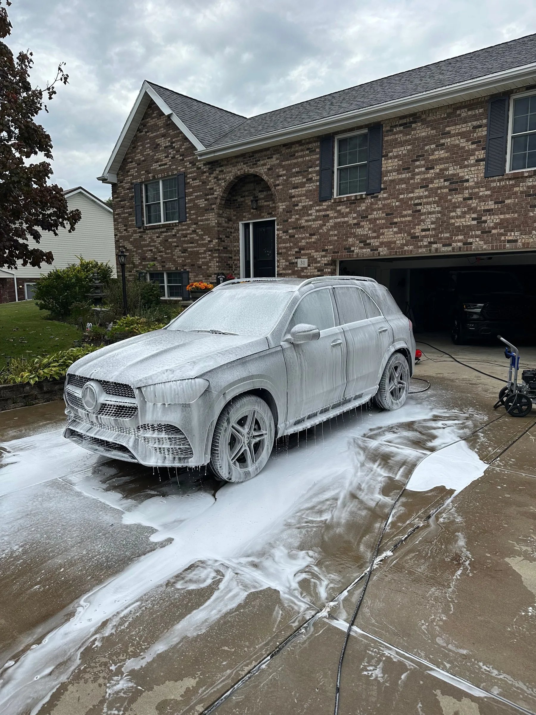Mercedes GLE during a foam decontamination wash